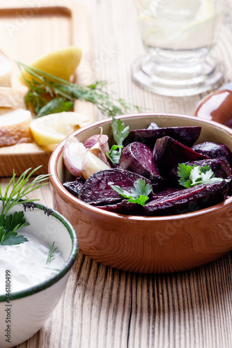 Healthy vegetarian meal, fresh Greek yoghurt with herbs, baked beetroot