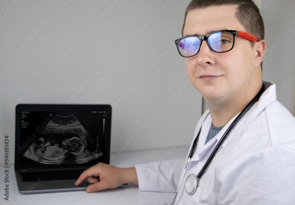 A gynecologist examines the result of an ultrasound examination of the fetus on a computer monitor. Pregnancy management concept A gynecologist examines the result of an ultrasound examination of the fetus on a computer monitor. Pregnancy management concept
