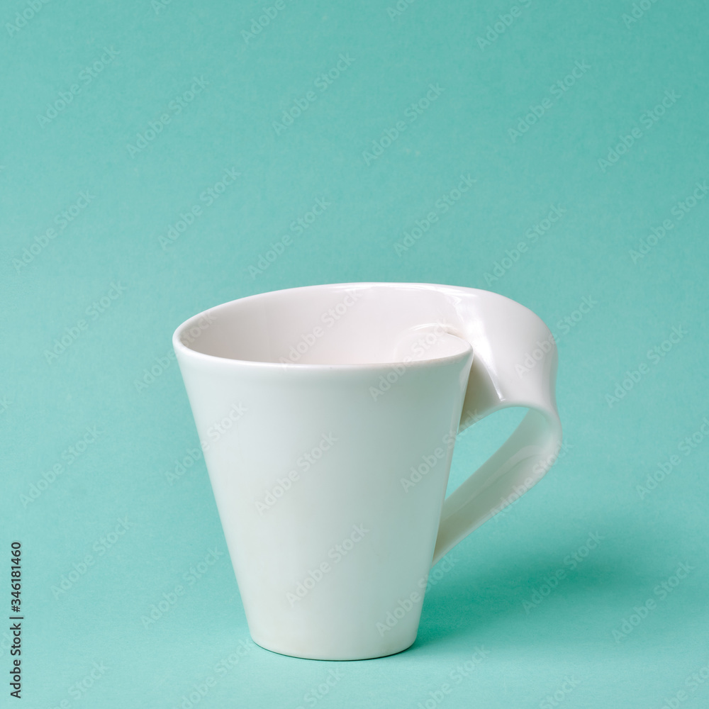 Cup for coffee and tea on a turquoise background Cup for coffee and tea on a turquoise background