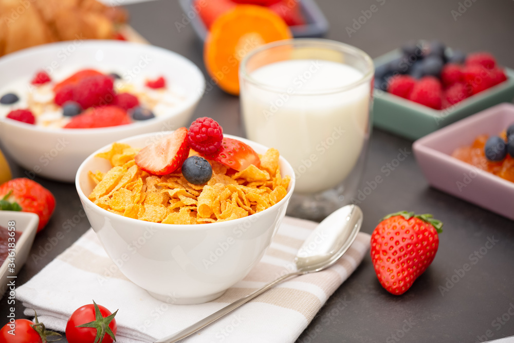 Breakfast Served in the morning with Coffee, Butter croissant and corn flakes Whole grains and raisins with milk in cups and Strawberry, Raspberry, Kiwi, Fresh Orange Juice on the breakfast table. Breakfast Served in the morning with Coffee, Butter croissant and corn flakes Whole grains and raisins with milk in cups and Strawberry, Raspberry, Kiwi, Fresh Orange Juice on the breakfast table.