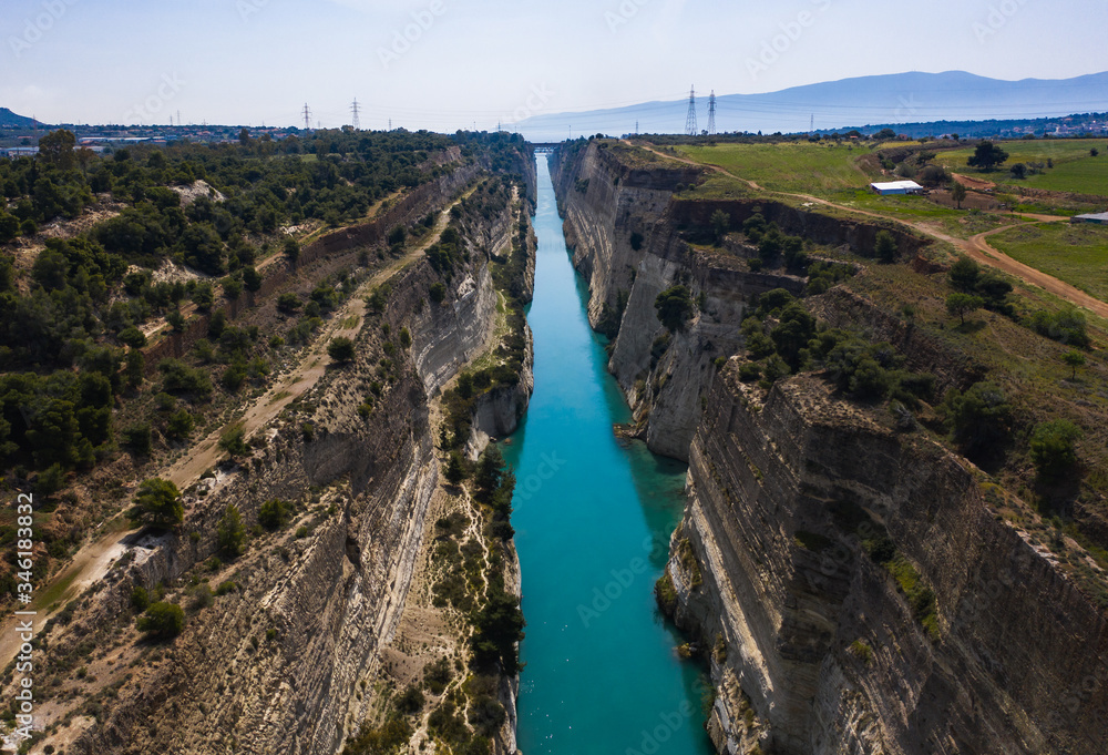 Fototapeta premium The Corinth Canal is a canal that connects the Gulf of Corinth with the Saronic Gulf in the Aegean Sea. It cuts Isthmus of Corinth and separates Peloponnese from the Greek mainland.
