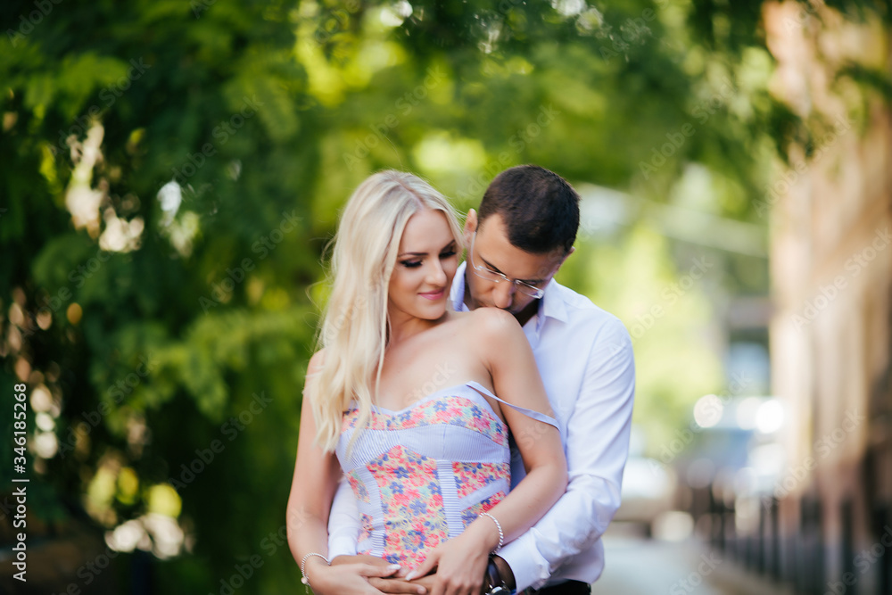 woman with her husband walking around the city, dressed neatly woman with her husband walking around the city, dressed neatly