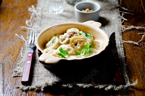 Dumplings in meat broth. Traditional meat dish of Russian cuisine photo