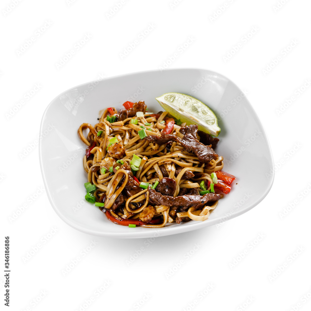 Fried udon noodles in a wok with beef, bell pepper and broccoli. Traditional asian food. Isolated on a white background. Fried udon noodles in a wok with beef, bell pepper and broccoli. Traditional asian food. Isolated on a white background.