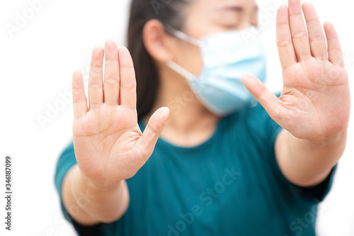 The image face of a young Asian woman wearing a mask to prevent germs, toxic fumes, and dust. Prevention of bacterial infection in the air in a white background © Bussarin