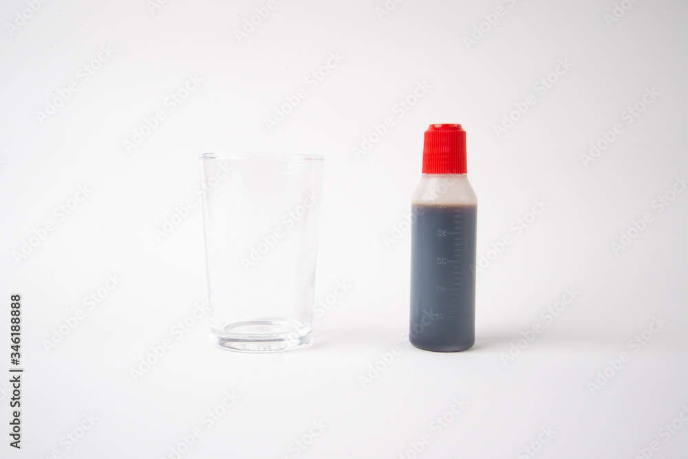 A cup with a gargle うがい薬 A cup with a gargle うがい薬