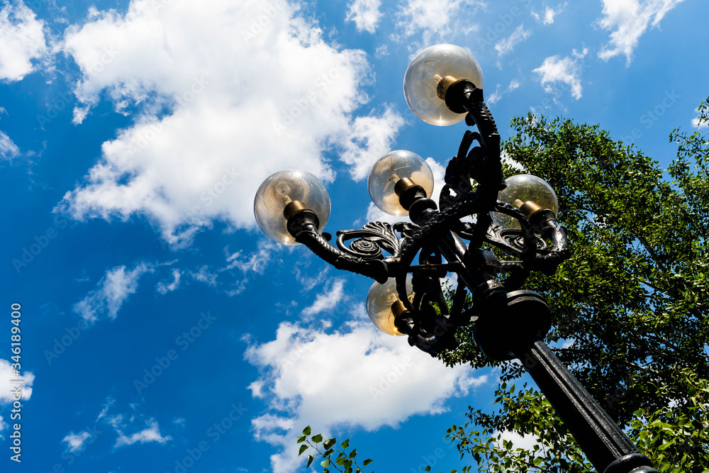 Cast-iron lantern in the summer Park