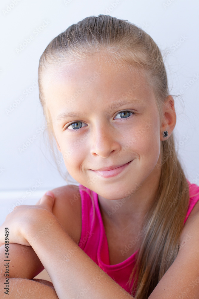 Portrait of happy teenager girl smiling looking at camera. White background. Portrait of happy teenager girl smiling looking at camera. White background.
