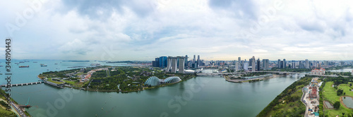 View from above, stunning aerial view of the skyline of Singapore during a cloudy day with the financial district in the distance.