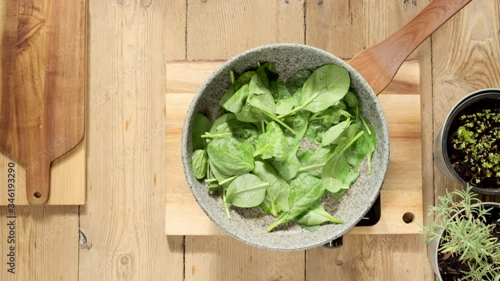 Cooking spinach in stone pan,
wooden stylization, old wood. Cooking spinach in stone pan,
wooden stylization, old wood.