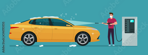 A man in medical mask washes a car in a self-service car wash. Vector illustration.