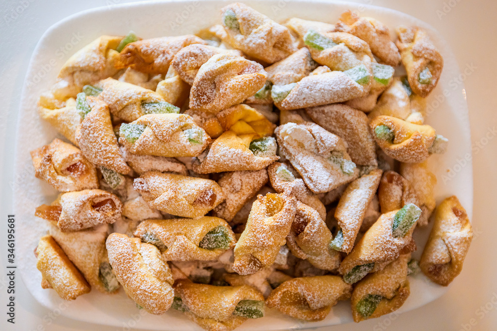 Cornulețe. A traditional Romania dessert that is a small croissant stuffed with jam or Turkish delight sprinkled with icing sugar Cornulețe. A traditional Romania dessert that is a small croissant stuffed with jam or Turkish delight sprinkled with icing sugar