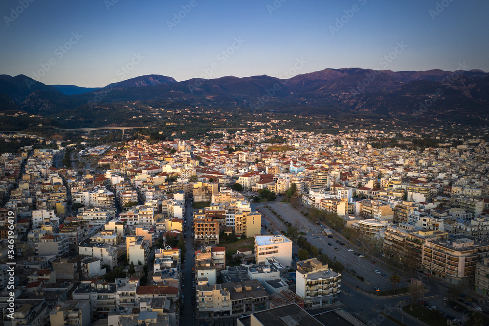 Aerial view of the wonderful old town of Kalamata City and the historical Castle at Sunset. Kalamata has become a top tourist attraction located in Messinia, Peloponnese, Greece.