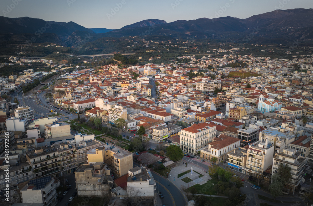 Aerial view of the wonderful old town of Kalamata City and the historical Castle at Sunset. Kalamata has become a top tourist attraction located in Messinia, Peloponnese, Greece.