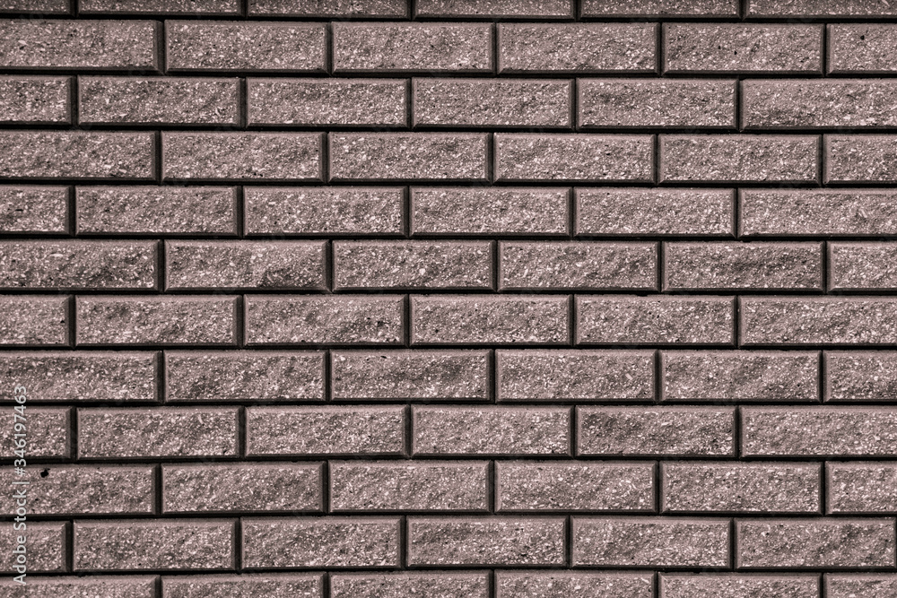 Brown background with black geometric patterns. Brown wall of rectangular stones, bricks, tile Brown background with black geometric patterns. Brown wall of rectangular stones, bricks, tile
