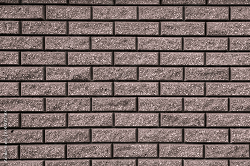 Brown background with black geometric patterns. Brown wall of rectangular stones, bricks, tile