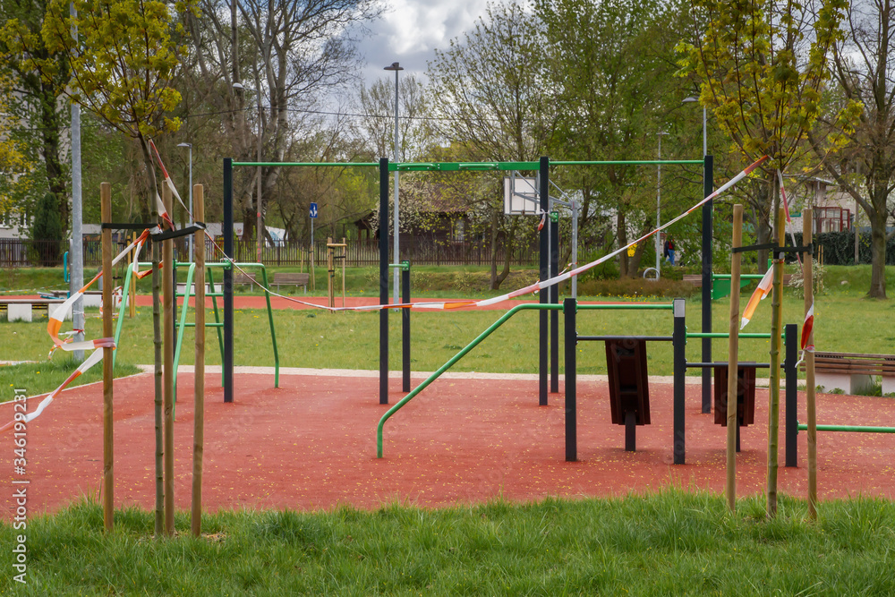 Sports ground with horizontal bars. Closed by a red ribbon. Sports ground with horizontal bars. Closed by a red ribbon.