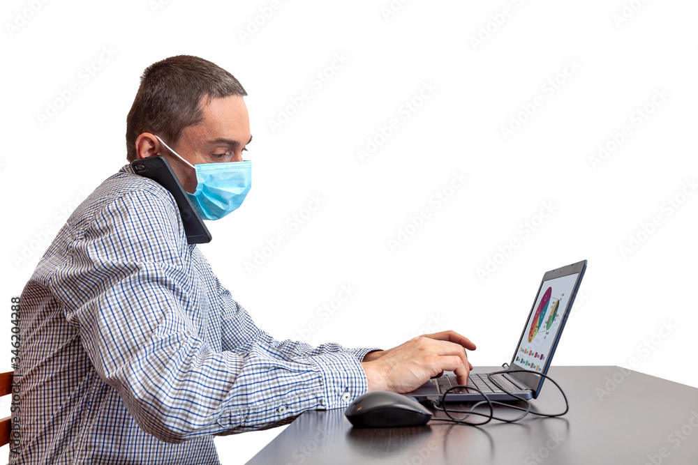 Business Man in quarantine for coronavirus working at his office desk wearing protective face mask. Home office environment isolated on white background. Covid19 Office new norm protection measures. Business Man in quarantine for coronavirus working at his office desk wearing protective face mask. Home office environment isolated on white background. Covid19 Office new norm protection measures.