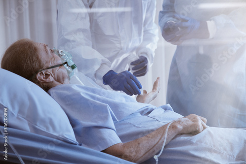 Obraz na płótnie Hopeless mood on Infected patient during lying on bed at quarantine room area in hospital. Case from coronavirus covid 19 disease. Covid19 or corona virus is world global social issue concept. w salonie