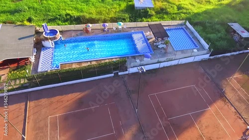 Pool in the middle of sugar cane crops photo