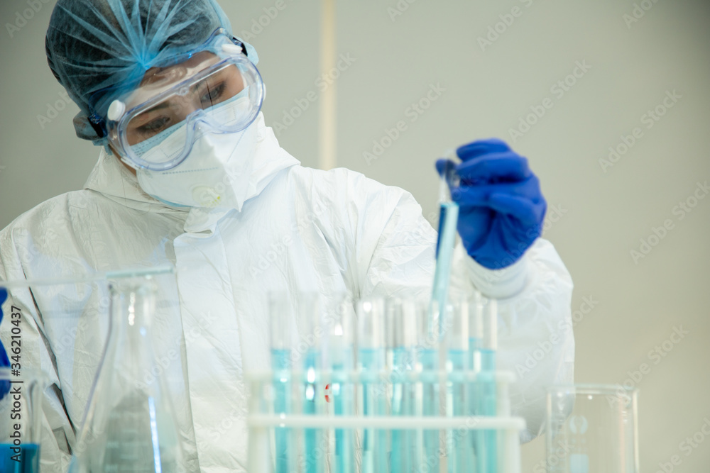 Scientist in laboratory with test tubes on Covid19 Coronavirus type for discover vaccine. Scientist in laboratory with test tubes on Covid19 Coronavirus type for discover vaccine.
