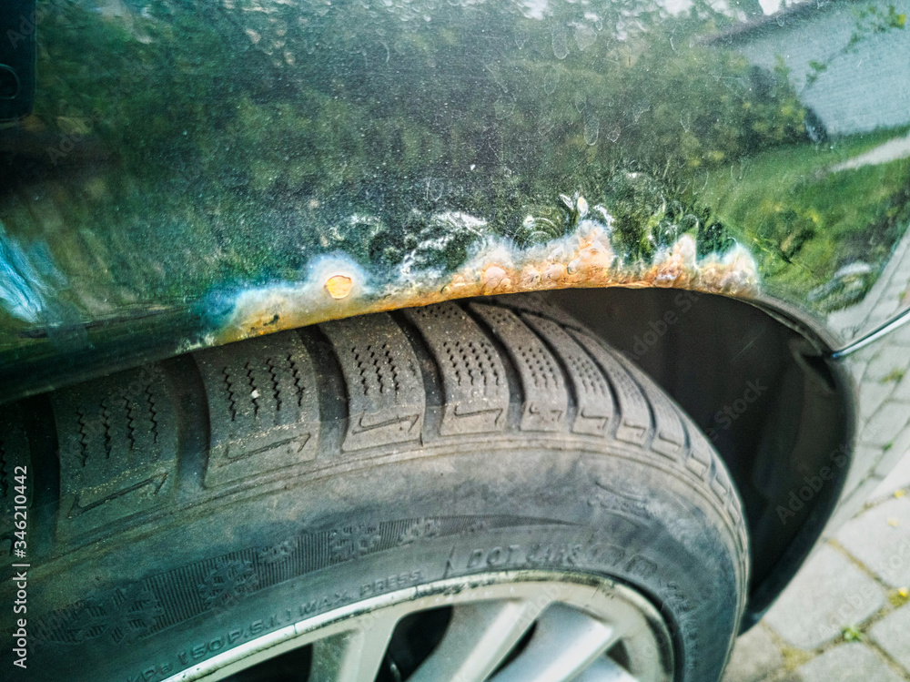 custom made wallpaper toronto digitalIsolated close-up of rusting black car front right wing after poor quality accident repair and time, salt damage