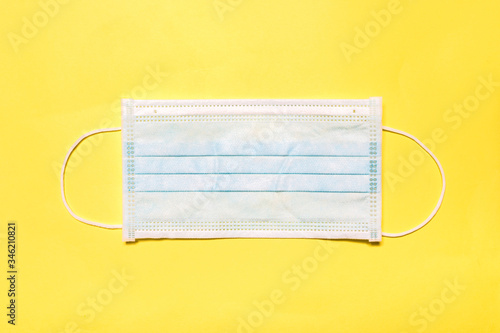 medical mask on a yellow background