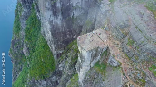 Aerial drone flight over Pulpit Rock a.k.a. Preacher’s Chair. The famous tourist place Preikestolen in the mountains of Norway. Taken in summer in foggy weather
