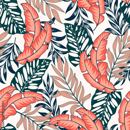 Abstract seamless tropical pattern with bright plants and leaves on a light background. Seamless exotic pattern with tropical plants. Summer colorful hawaiian seamless pattern with tropical plants.