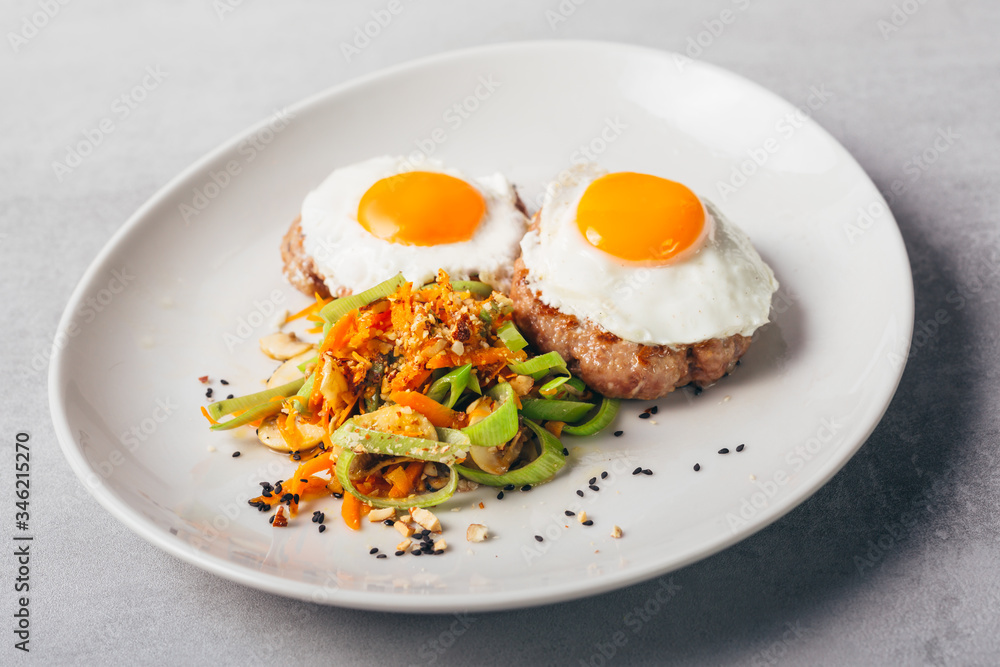 baked eggs and burgers meal with roasted vegetables baked eggs and burgers meal with roasted vegetables