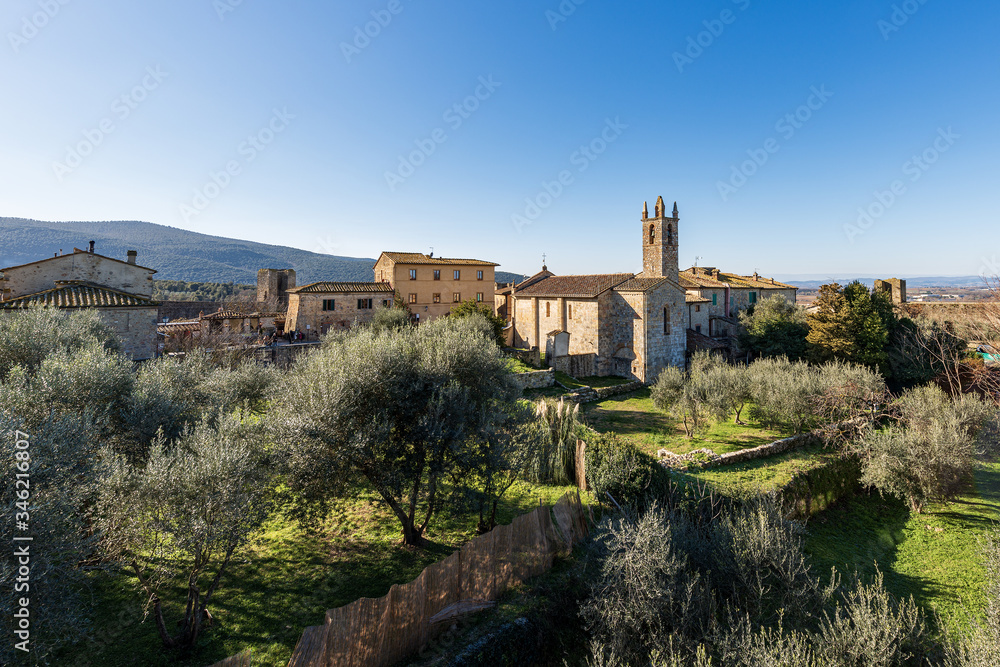 Fototapeta premium Medieval village of Monteriggioni. Church of Santa Maria Assunta (XIII century) and surrounding wall. Siena province, Tuscany, Italy, Europe
