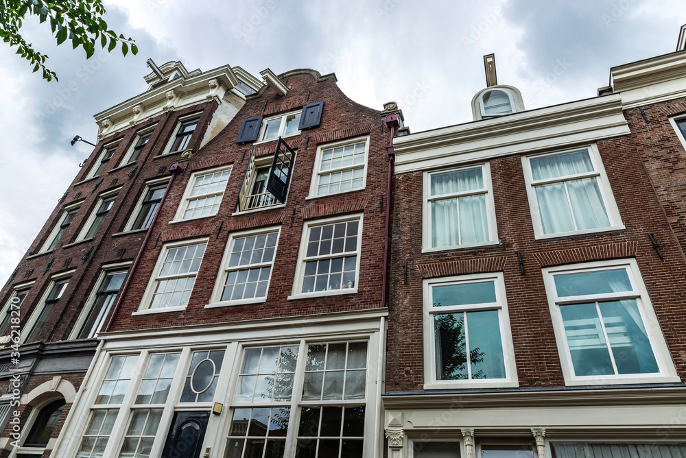 Old traditional leaning houses in Amsterdam, Netherlands