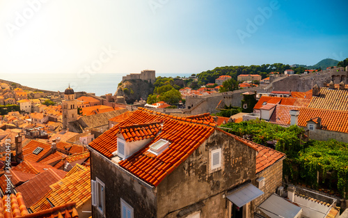 View of the old city with red tiles, over the sea
