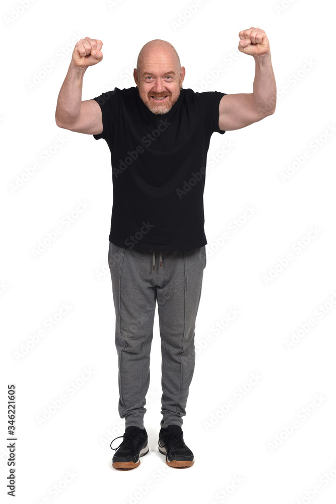 man with sportswear with fist raised on white background man with sportswear with fist raised on white background