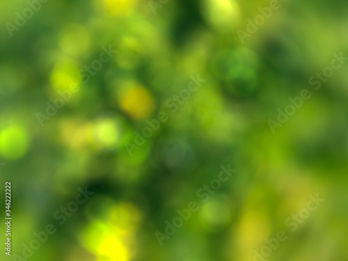 Abstract blured summer fresh background with lighting bokeh effect in green and yellow colors;