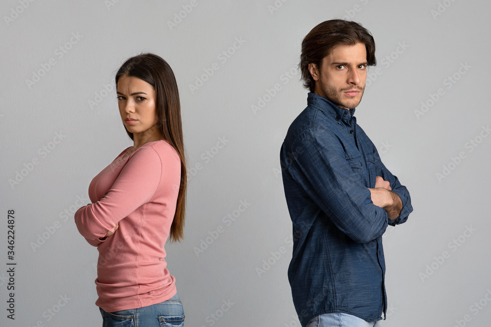 Break Up. Offended man and woman standing back to back after arguing Break Up. Offended man and woman standing back to back after arguing