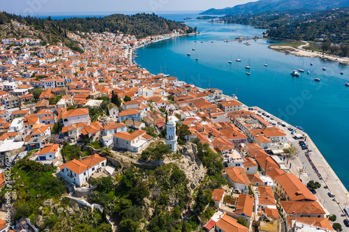 Aerial drone bird's eye view photo of the clock tower of Poros island, Greece