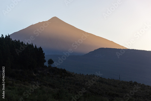 Majestic red Teide volcano is lit with the sunset in Tenerife, Canary Islands, Spain.