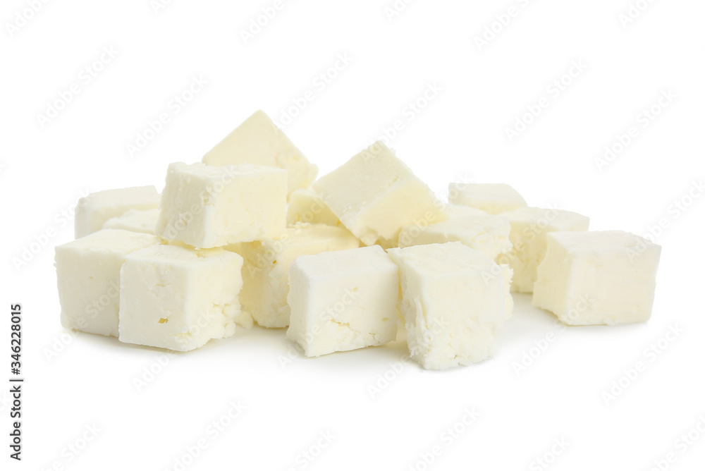 Tasty cut feta cheese on white background