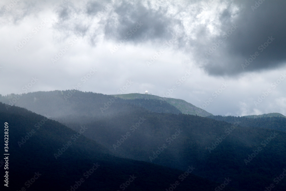 Obraz premium Mount Jura Alps in France, Ain before the rain. Mountains in the fog.