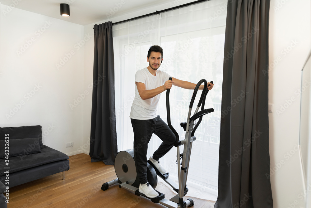 A man goes in for sports at home during quarantine. A man goes in for sports at home during quarantine.