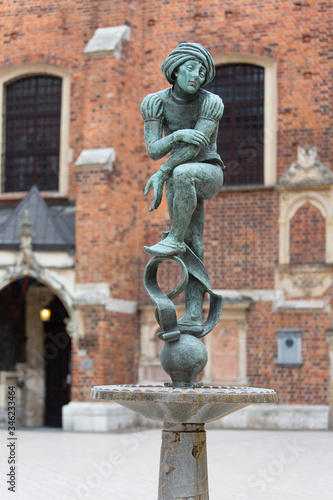 Figurine student, a copy of the form from the altar of Veit Stoss, fountain in the square of St. Mary's, Krakow, Poland