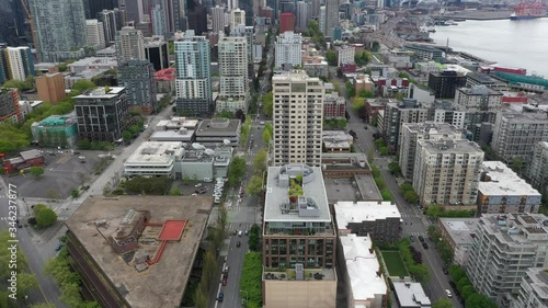 Aerial / drone footage of the abandoned streets without people and traffic downtown, in the commercial district of Seattle, Washington during the pandemic
