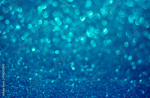 Abstract blue green bokeh light background. Cristal effect. Defocus