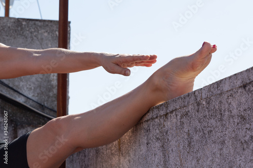 Gimnasia en la terraza, flexibilidad  photo