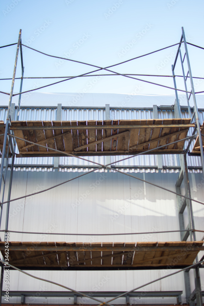 building wooden metal from scaffolding pipes bottom view background place for text building wooden metal from scaffolding pipes bottom view background place for text