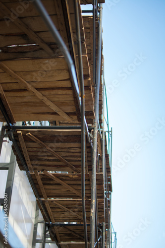 building wooden metal from scaffolding pipes bottom view background place for text