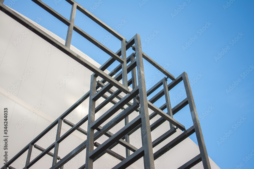 metal structures made of pipes of a building under construction against the blue sky metal structures made of pipes of a building under construction against the blue sky