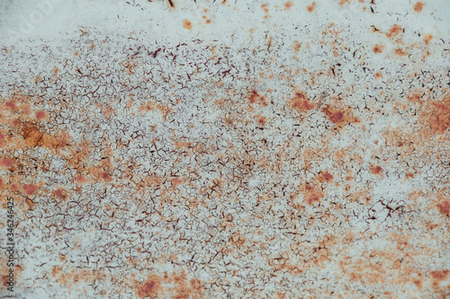 backdrop with rust on metal. gray paint with cracks on rusty metal