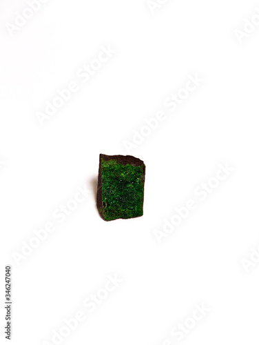 Fototapeta Naklejka Na Ścianę i Meble -  green uvarovite mineral on a white background